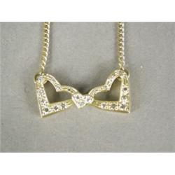 A diamond double heart pendant set in 18ct gold, 3cm wide on an 18ct gold flat curb link chain, 4...