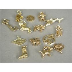 A collection of fourteen various 9ct gold charms Est. 50/80...