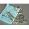 Image 1 : Two silver Tiffany & Co items: a key ring (removable tag engraved DKH), and a bracelet heightened...