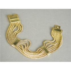 A Victorian yellow metal seven strand floral design bracelet, 19cm long Est. 500/600...