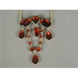 A Victorian garnet necklace, the round, oval and pear shape stones with closed back settings in g...