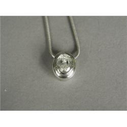 An oval diamond solitaire pendant (approx 1.5cts), bezel set in 18ct white gold, on a snake chain...