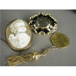 Three items: A mourning brooch, cameo brooch and a mounted guinea with tassel Est. 80/120...