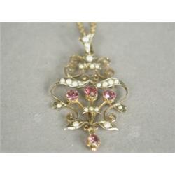 An antique 9ct gold pendant set with pink tourmaline and seed pearls, 4cm long, on a chain Est. 1...