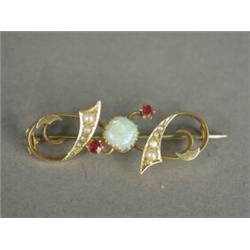 A 15ct gold bar brooch set with an opal, rubies and seed pearls, 4cm long Est. 70/100...