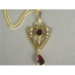 A 9ct gold Art Nouveau pendant set with amethysts and seed pearls, 5cm long, on a 9ct chain Est....