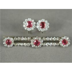 A ruby and old cut diamond bar brooch, 4.5cm long with matched screw earrings, set with brilliant...