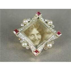 A yellow metal mounted picture brooch/pendant, with an old cut diamond and cultured pearl set fra...