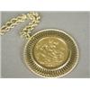 Image 1 : An 1880 gold sovereign, mounted in 9ct gold, on a 74cm 9ct gold rope chain Est. 60/100...