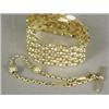Image 1 : Two bracelets: an 18ct gold fancy gatelink, 18cm long, and a yellow metal belcher link Albert cha...