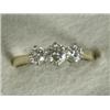 Image 1 : A three stone diamond ring set in 18ct gold, size M 1/2 Est. 450/550...
