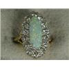 Image 1 : An opal and diamond marquise cluster ring size L 1/2 (opal 16 x 6mm, total diamond weight approx...