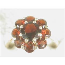 A 9ct gold garnet cluster ring, size K Est. 50/80...