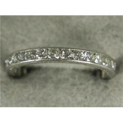 A diamond eternity ring, channel set with brilliant cut stones in engraved white metal (test plat...