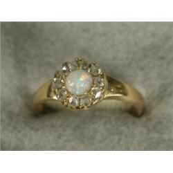 A 22ct gold opal and diamond cluster ring, set with ten rose cut diamonds, ring size K Est. 80/12...