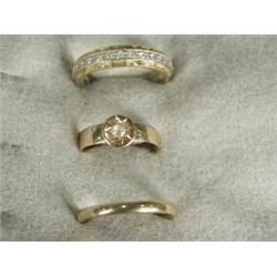 Three rings including a bi-colour 18ct gold eternity ring Est. 80/120...