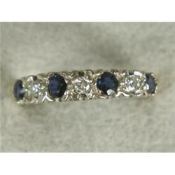 A sapphire and diamond seven stone ring, set in 18ct gold, size O Est. 120/160...