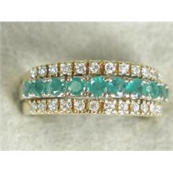 A 15ct gold three row 1/2 eternity ring, set with emeralds and diamonds, size O Est. 150/200...