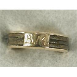 An antique gold mourning ring channel set with elephant hair, monogram B.M, size N 1/2 Est. 50/80...