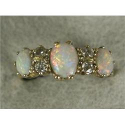 An opal and diamond engraved 1/2 hoop ring set with three cabochon opals and four old cut diamond...