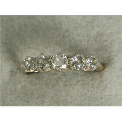 A five stone diamond half hoop ring, size P Est. 300/500...