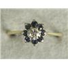 Image 1 : A sapphire and diamond cluster ring, size Q Est. 100/150...