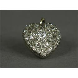 A late Victorian old cut diamond encrusted locket pendant with diamond set bail, 2cm long Est. 12...