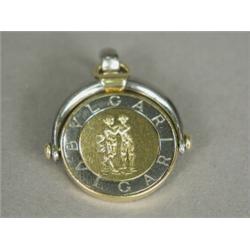 A Bulgari swivel fob pendant, 2.5cm in diameter Est. 200/300...