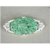 Image 1 : A diamond and carved jade brooch, set with approx 0.75ct of diamonds Est. 175/275...