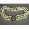 Image 1 : A three row 7.25mm cultured pearl choker, with a ruby and diamond clasp, 34cm long Est. 1000/1500...