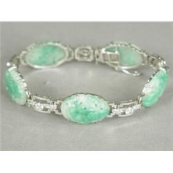 A diamond and carved jade bracelet set with approx 1ct of diamonds, in 18ct white gold and platin...