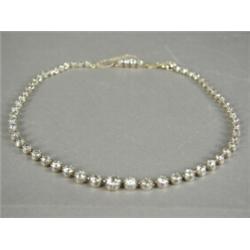 A Victorian old cut diamond graduated necklace, 32cm long, set with approx 11cts of diamonds Est....