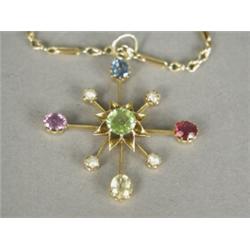 A seed pearl and gem set pendant, 3.5cm long on a 15ct gold rope and twist fetter chain Est. 80/1...