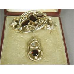 A Victorian yellow metal and garnet brooch and pendant in a fitted case Est. 250/350...