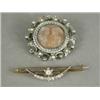 Image 1 : Two brooches: one diamond set, 4.5cm long, the other inset with seed pearls, 3cm diameter Est. 15...