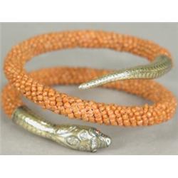 An antique coral and yellow metal snake bracelet Est. 120/160...