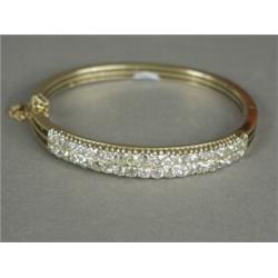 A late Victorian hinged bangled set with forty old cut diamonds in yellow metal (tests 18ct gold)...