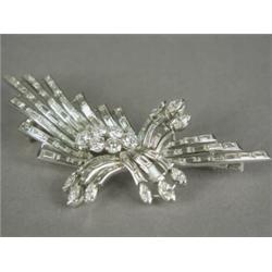 A diamond spray brooch set in platinum, 8.5cm long Est. 4000/6000...