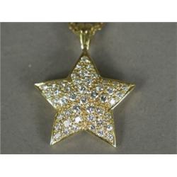 A diamond star pendant set in 18ct gold, 2.5cm in diameter, on an 18ct gold chain, 32cm long Est....