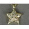 Image 1 : A diamond star pendant set in 18ct gold, 2.5cm in diameter, on an 18ct gold chain, 32cm long Est....
