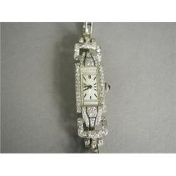 A platinum and diamond ladies cocktail watch, set with approx 2.3cts of eight-cut diamonds (on a...
