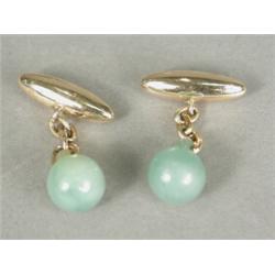 A pair of 10ct gold and jade cufflinks Est. 60/80...