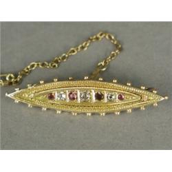A Victorian 15ct gold bar brooch set with old cut diamonds and rubies, with wirework decoration a...