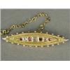 Image 1 : A Victorian 15ct gold bar brooch set with old cut diamonds and rubies, with wirework decoration a...