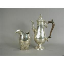 A Sheffield plate jug, 18cm high, and a plated coffee pot Est. 100/150...