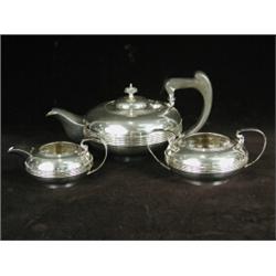 A George V silver three piece tea service 1917, pot 13cm high Est. 200/300...