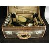 Image 1 : A leather case containing a toiletry set with silver topped bottles Est. 250/350...
