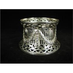 A miniature silver dish ring with embossed swags and a pierced surround, Birmingham 1909, 10cm di...