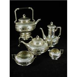 A Victorian silver five piece tea and coffee service including a plated spirit kettle burner and...