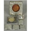 Image 1 : A silver mounted watch holder 1903, two small silver mounted photograph frames and four silver ve...